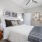 Large well lit bedroom with plush carpets and large windows 