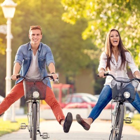 The Carson young couple riding their bike and having fun